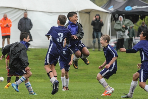 INTO THE FINALS: Nelson Royal 11th grade players celebrate winning the Jack McKnight semi-final on Saturday morning. They are from left; Simon Wilson, Alex Lindbom, Bawi Chung Hichal and Lucas Hogg. Photo: Phillip Rollo.