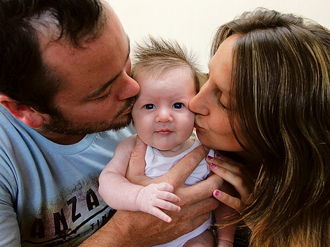 Baby Jackson Helliwell with his parents Dion and Brenda. Photo: Phillip Rollo.