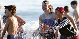 While some shot off for a hot shower and a Milo, most of the 100 students, including Emma Newson, Zara Stevenson and Sam Moritz had to be encouraged to leave the water, clearly happy and warm enough.