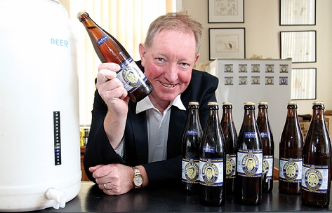 Nelson MP Nick Smith with his home brew which he will be serving to delegates of the National Party Conference in Nelson this weekend. Photo: Andrew Board.