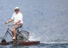 Nelson’s Sam Laidlaw pedals around Lake Rotoiti on his water bicycle, always a crowd favorite at the NZ Antique and Classic Boat Show. Photo: Phillip Rollo.