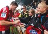 Crusaders player Colin Slade signs autographs for fans at Sportspark Motueka on Friday night. Photo: Phillip Rollo.