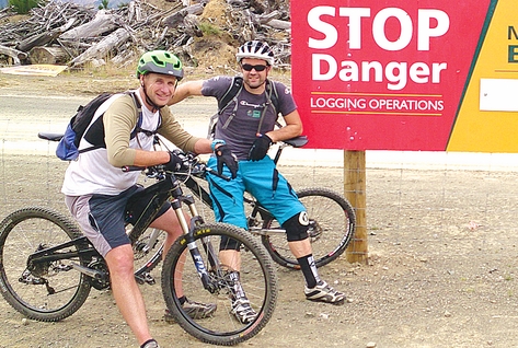 Nelson Mountain Bike Club members Glen Hersey, left, and Jamie Bate by one of the warning signs notifying riders about the closure of tracks.