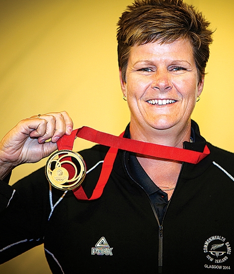 Lawn bowler Jo Edwards shows off her Commonwealth Games gold medal. Photo: Phillip Rollo.