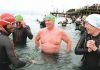 Swimmers, from left, Richard Ussher, Steve Malthus, Digby Kynaston and Kerry Mathieson brave the cold as they enter the water for the Blue September charity sea swim in Port Nelson on Sunday. Photo: Simon Bloomberg.
