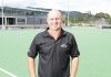 Nelson Hockey's development officer, Craig Brett, on the Saxton Field hockey turf that will host a New Zealand hockey test for the first time in 62 years. Insert left: The cover of the test programme the last time New Zealand played a test in Nelson, against Australia in 1952. Insert right: The New Zealand that played the Nelson test, including Nelson man Fred Gribble [circled]. Photo: Andrew Board.